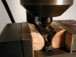 Cutting the ferrule-shaped groove by moving the cutter into the frog.