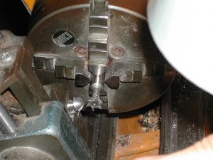 Cutting the blades into the blank rod: the dovetail cutter is mounted in the lathe; the blank is mounted in a milling attachment on the lathe compound.