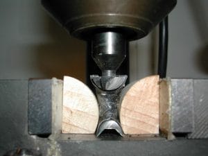 The cutter clamped into the milling head and centered on the frog.